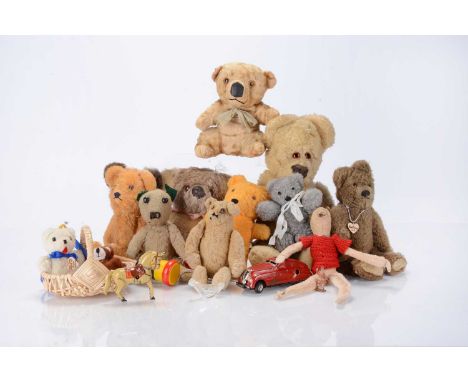 Eleven small teddy bears and soft toys, including a blonde art silk koala, a white wool plush bear —15in. (38cm.) high; a Ros