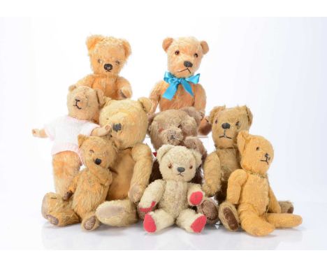 Nine post-war British teddy bears,  including a Chad Valley with golden mohair and label to foot pad —14in. (35.5cm.) high; a