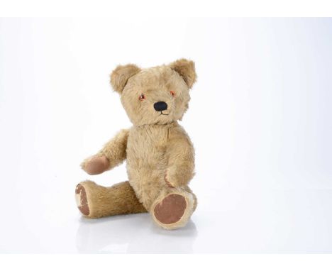 A Chad Valley post-war teddy bear,  with light golden mohair, orange and black plastic eyes, black stitched nose and mouth, s