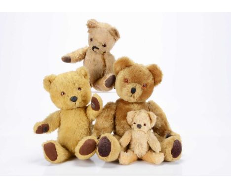 Three post-war Chad Valley teddy bears, a small blonde mohair bear, with orange and black glass eyes, black stitched nose and