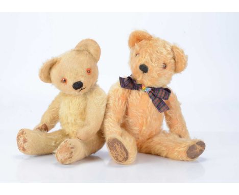 Two post-war Chad Valley teddy bears, one with golden mohair, orange and black glass eyes, black stitched nose and mouth, swi