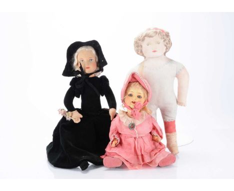 A 1930s British lady doll pyjama case,  with white mohair wig, moulded cloth face, painted eyes and mouth, black velvet body 