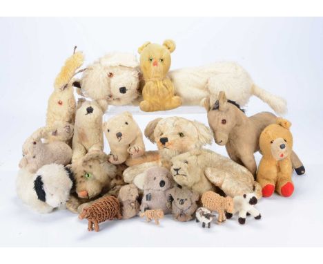 Various soft toy animals, a post-war Steiff reclining leopard —13in. (33cm.) long; a donkey, a lion and cub, an Alpha Farnell
