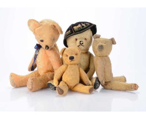 A 1920/30s German teddy bear,  with golden mohair, pronounced muzzle, remains of black stitched nose and mouth, black stitche