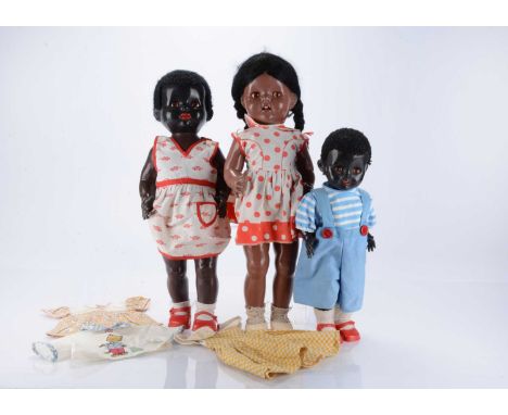 Three 1950s Pedigree black hard plastic walker dolls, including a Walking African Girl doll, with orange /brown sleeping  eye