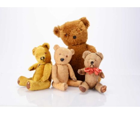 Four post-war British teddy bears,  a Merrythought Winnie- the-Pooh, a cinnamon Gwen Toys bear —21 ½in. (54.5cm.) high; and t