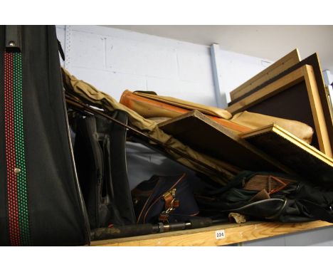 Shelf of assorted fishing rods etc.