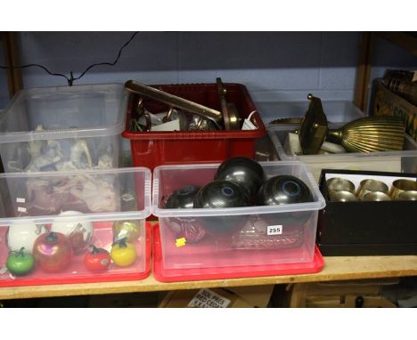 Shelf of assorted bowling balls, figures etc.