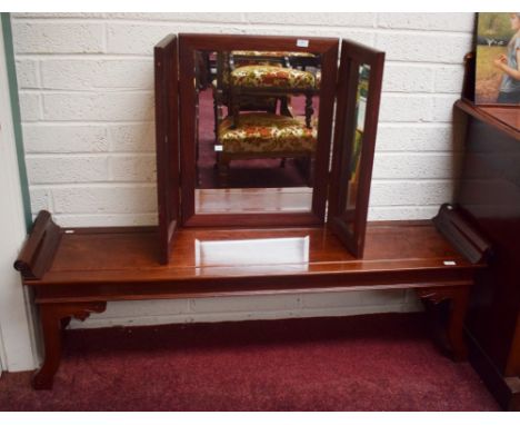 AN OBLONG CHINESE CHERRYWOOD WINDOW STOOL, with scroll ends flanking a solid seat, raised on shaped legs, 62” (158cm) wide; t