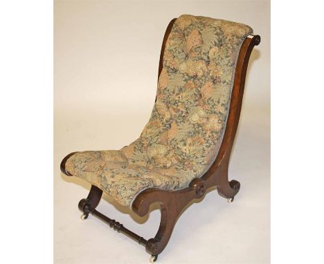A VICTORIAN WALNUT X-FRAMED OCCASIONAL CHAIR, with re-curving button back and seat, on scroll legs, united by turned stretche