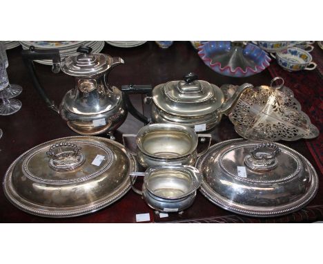A PIERCED AND SILVER PLATED SANDWICH STAND,  a pair of oval silver plated entrée dishes and covers,  and a four piece silver 