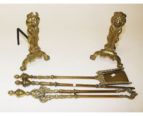 A LATE 19TH CENTURY PIERCED BRASS FENDER, with Greek key pattern, 55in (140cm); together with a set of three heavy brass fire