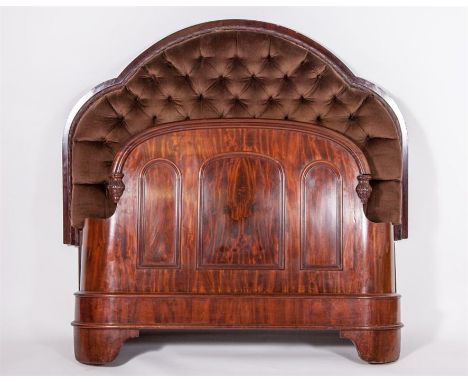 A VERY ORNATE VICTORIAN MAHOGANY BED, the button headboard covered in brown draylon, inside a moulded frame and a conforming 