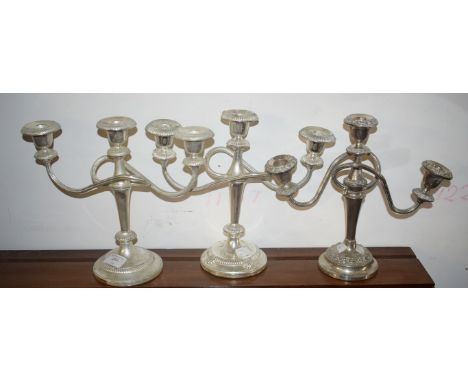 THREE SIMILAR TWO BRANCH THREE LIGHT SILVER PLATED CANDELABRA. (3) 