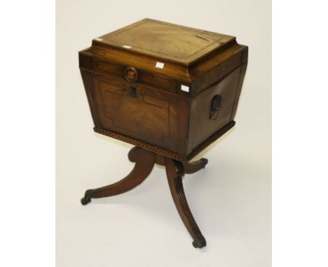 A REGENCY PERIOD MAHOGANY AND ROSEWOOD BANDED TEAPOY, of sarcophagus form, the hinged and domed top opening to reveal four co