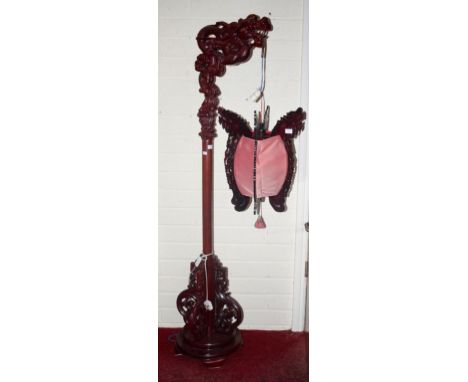 A CHINESE CARVED STANDARD LANTERN, O.R.M., the upper bracket carved in the form of a dragon, and four scroll spandrels below 