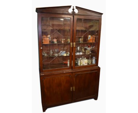 A LARGE MAHOGANY LIBRARY BOOKCASE,  George III and later, with dentil moulded divided pediment above two astragal glazed door