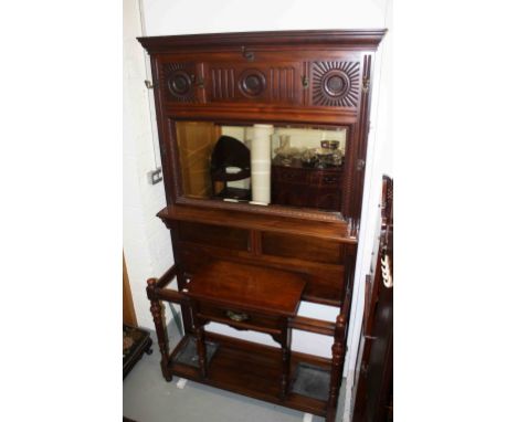 A LATE VICTORIAN OR EARLY EDWARDIAN HALL STAND,  the moulded cornice above a carved and fluted frieze, above four brass hooks