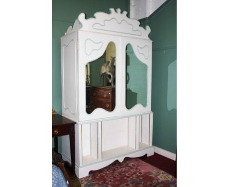 A VERY LARGE PAIR OF MODERN CREAM AND LIGHT GREEN PAINTED LINEN CUPBOARDS OR WARDROBES,  each with a shaped and moulded corni