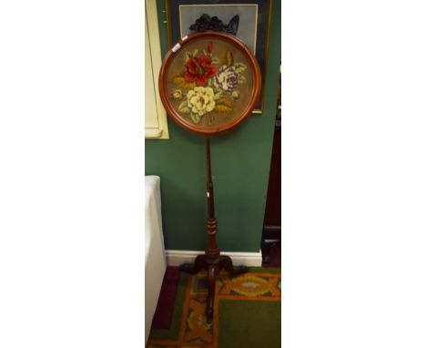 A walnut pole screen, Victorian, with circular tapestry panel crested with flowers on a turned stem and tripod base, as is, 5