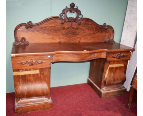 A VICTORIAN SERPENTINE FRONTED MAHOGANY PEDESTAL SIDE BOARD, with shaped arch back, above a frieze drawer, raised on two pede