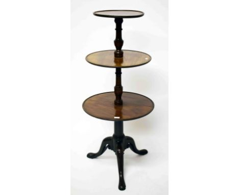 A GEORGE III THREE-TIER CIRCULAR DUMBWAITER, with graduating shelves, on pierced tripod base, with pad feet, 50.5'' (129cm)h 
