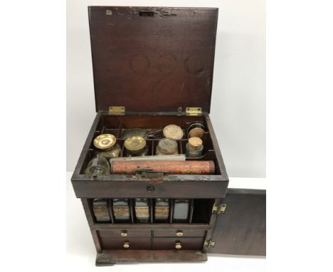 A 19th Century mahogany apothecary box containing various bottles, scales, etc., 23.5 cm wide x 19.5 cm deep x 27 cm high