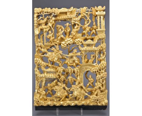 A CHINESE GILT LACQUER WOOD PANEL, 19TH CENTURY. Heavily carved with warrior scene with soldiers on horseback and foot fighti