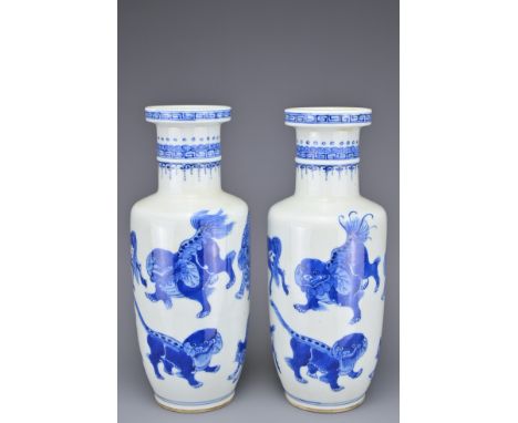 A PAIR OF CHINESE BLUE AND WHITE PORCELAIN ROULEAU FORM VASES, EARLY 20TH CENTURY. Each decorated with various animal forms i
