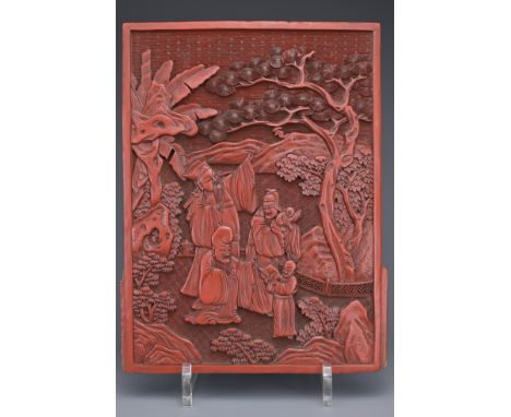 A CHINESE CINNABAR LACQUER PANEL, 19TH CENTURY. Well carved in relief with scholar figures in a landscape scene. 25.5cm x 19c