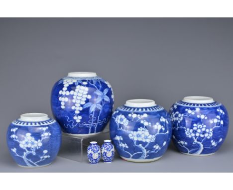 FOUR CHINESE BLUE AND WHITE PORCELAIN GINGER JARS, 19/20TH CENTURY. One jar with grape vine decoration with four-character ma