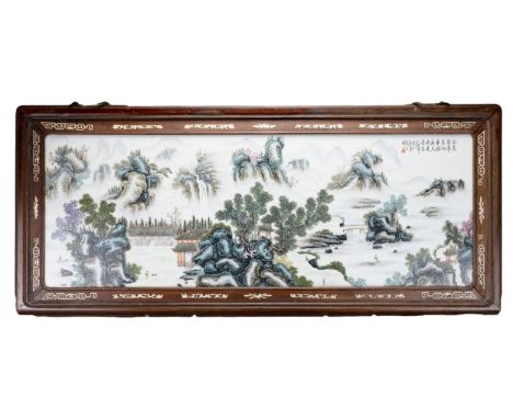 A LARGE CHINESE FRAMED PORCELAIN TILE, 20TH CENTURY. Painted with a landscape scene and calligraphy. Total frame size 103cm x