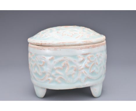 A CHINESE QINGBAI GLAZED TRIPOD INCENSE BURNER AND COVER. Of cylindrical form on rounded feet and cover with moulded decorati
