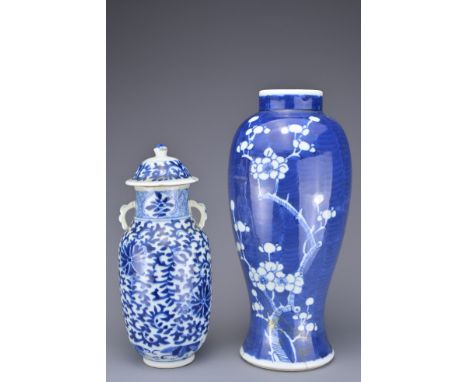 TWO CHINESE BLUE AND WHITE PORCELAIN VASES, 19TH CENTURY. To include a prunus decorated vase with double ring mark to base. T