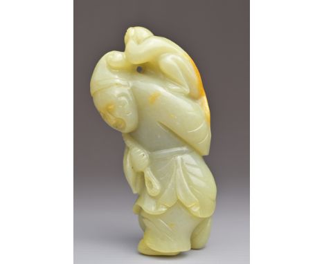 A CHINESE CELADON JADE CARVING OF A MAN WITH A MONKEY ON HIS BACK. 9cm height.Overall good condition without signs of damage 