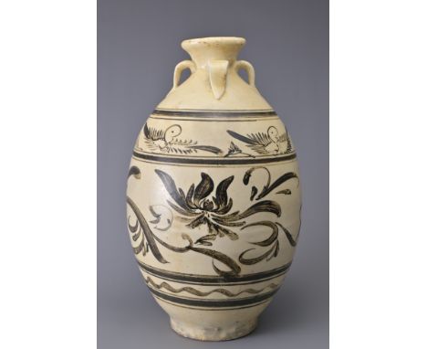 A TALL CHINESE CIZHOU STONEWARE JAR. With four loop handles at the shoulder and decorated in iron-brown on a creamy-white bac