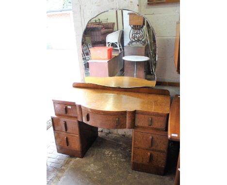 Art Deco burr walnut semi bow fronted dressing table with mirror, having seven drawers on plinth base, together with a Art De