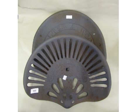 Two original early 20th Century cast iron tractor seats by Walter A. Wood, New York, USA 