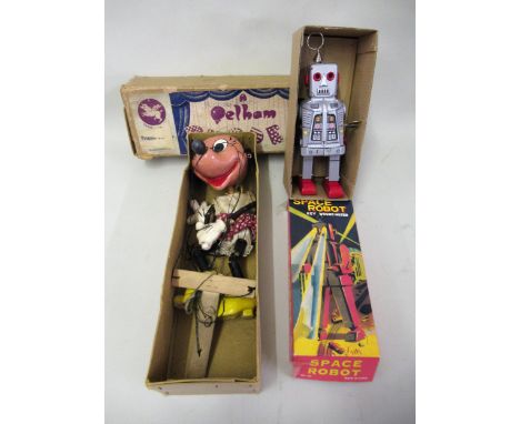 Chinese clockwork tin plate ' Space Robot ' in original box, together with a Pelham Minnie Mouse puppet in original boxSome d