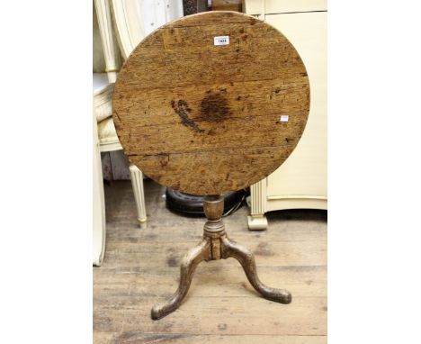 Small George III oak circular pedestal table, the tilt top above a vase turned centre column and tripod base, 52.5cms diamete