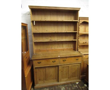 19th Century stripped pine dresser with boarded shelf back above two drawers and two cupboards, 137cm x 50cm x 213cm high 