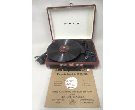 Glenn Miller and his orchestra 78 speed record, ' In the Mood ', together with a modern Bush portable record player 