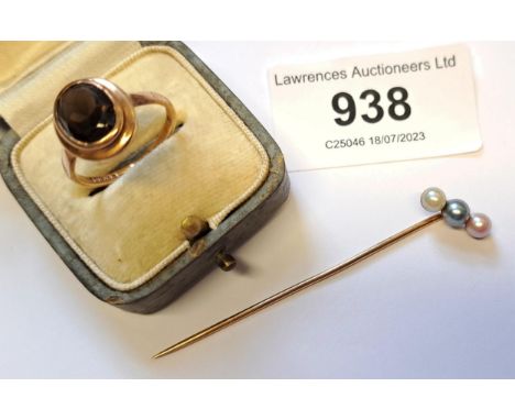 9ct Gold smoky quartz ring and a cultured pearl set stick pinVery small chip to face of ring, otherwise in good condition.Sti