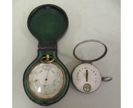 Brass pocket barometer with original outer case, together with a nickel plated pocket sundial with integral compass 