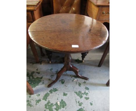 Small 18th Century mahogany pedestal table, the plain top above a baluster turned column support and tripod base, 61cms diame