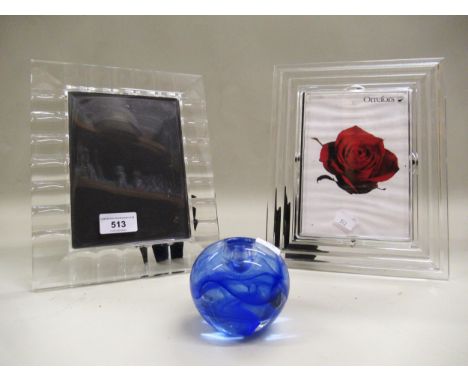 Orrefors Swedish glass photograph frame, a similar frame by Rosenthal and a Kosta Boda blue glass candlestick holder 