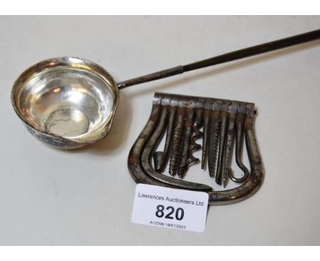 Antique coin inset toddy ladle with whale bone twisted handle, (at fault) and an early multi tool 