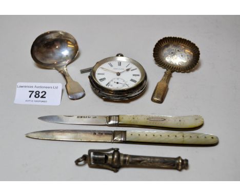 Victorian silver caddy spoon, Georgian silver caddy spoon, two mother of pearl silver bladed fruit knives, a white metal whis