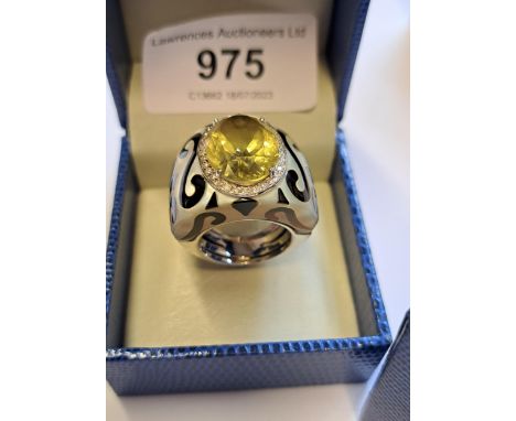 New Italian Art 18ct white gold dress ring set with an oval lemon citrine surrounded by diamonds, the mother of pearl shank i