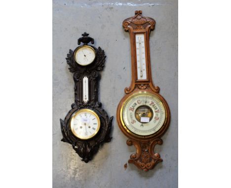 Cast iron barometer / thermometer by J.J. Wainwright & Co., together with another oak barometer 